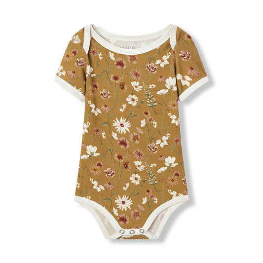 Floral-patterned baby onesie on a white background